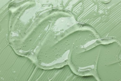 Photo of Collagen gel on green background, above view