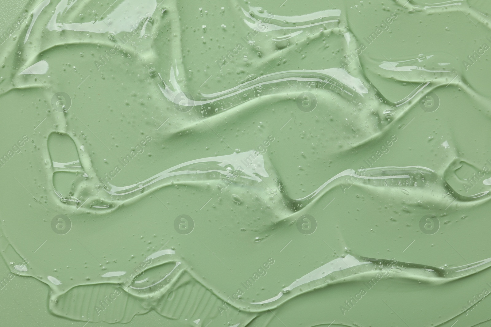 Collagen gel on green background, top view Photo of Collagen gel on green background, top view