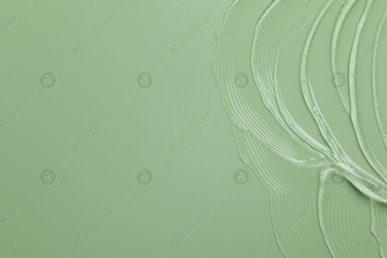 Collagen gel on green background, top view. Space for text Photo of Collagen gel on green background, top view. Space for text