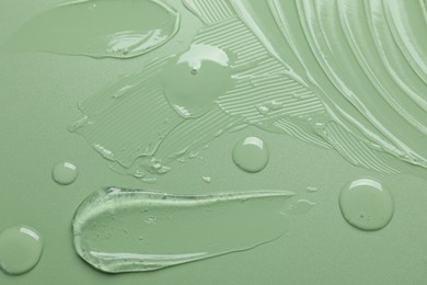Photo of Collagen gel on green background, top view