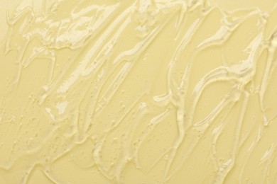 Photo of Collagen gel on yellow background, top view