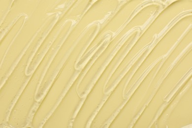 Photo of Collagen gel on yellow background, top view