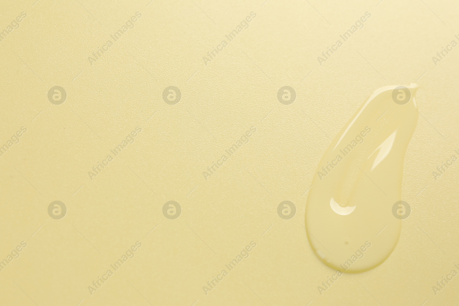 Collagen gel on yellow background, top view. Space for text Photo of Collagen gel on yellow background, top view. Space for text