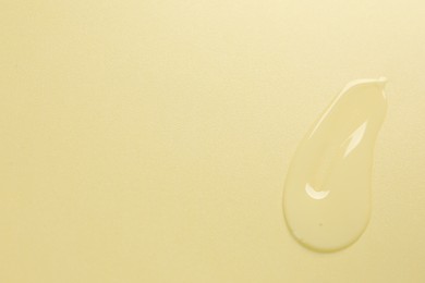 Photo of Collagen gel on yellow background, top view. Space for text
