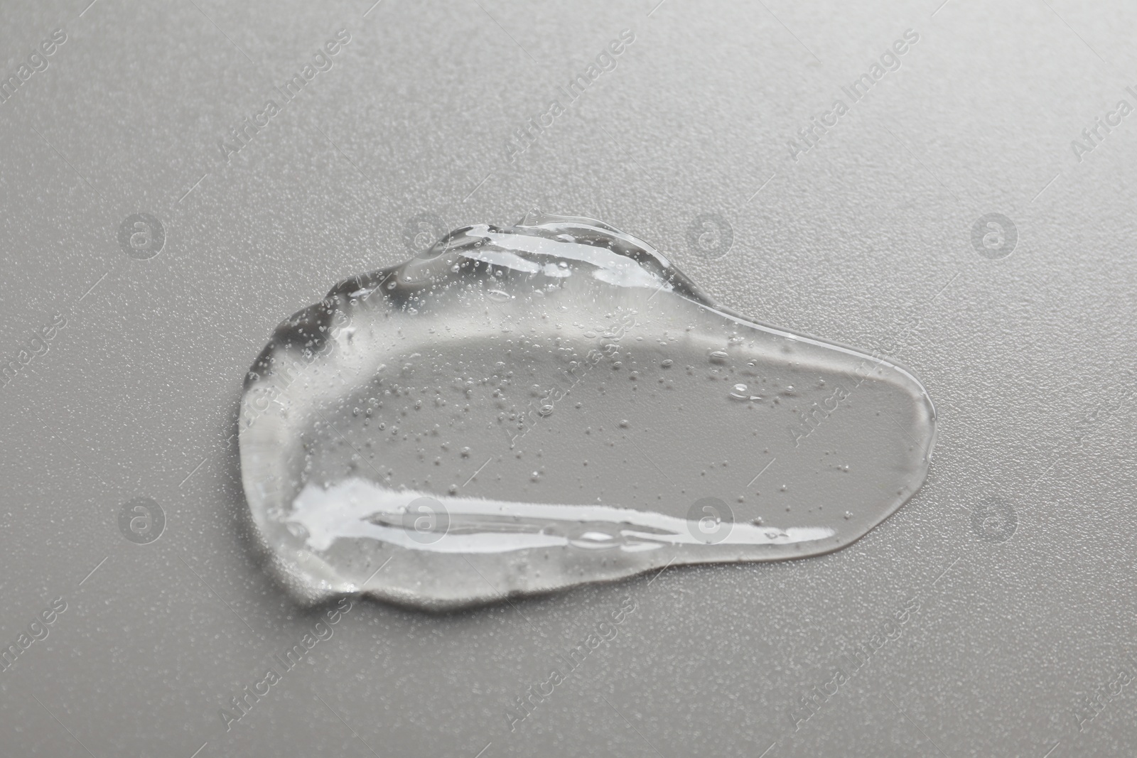 Collagen gel on grey background, above view Photo of Collagen gel on grey background, above view