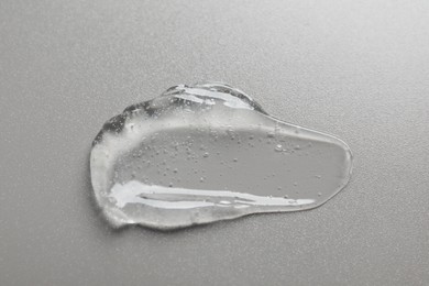 Photo of Collagen gel on grey background, above view