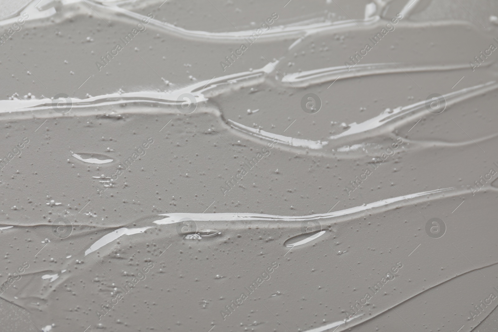 Collagen gel on grey background, above view Photo of Collagen gel on grey background, above view