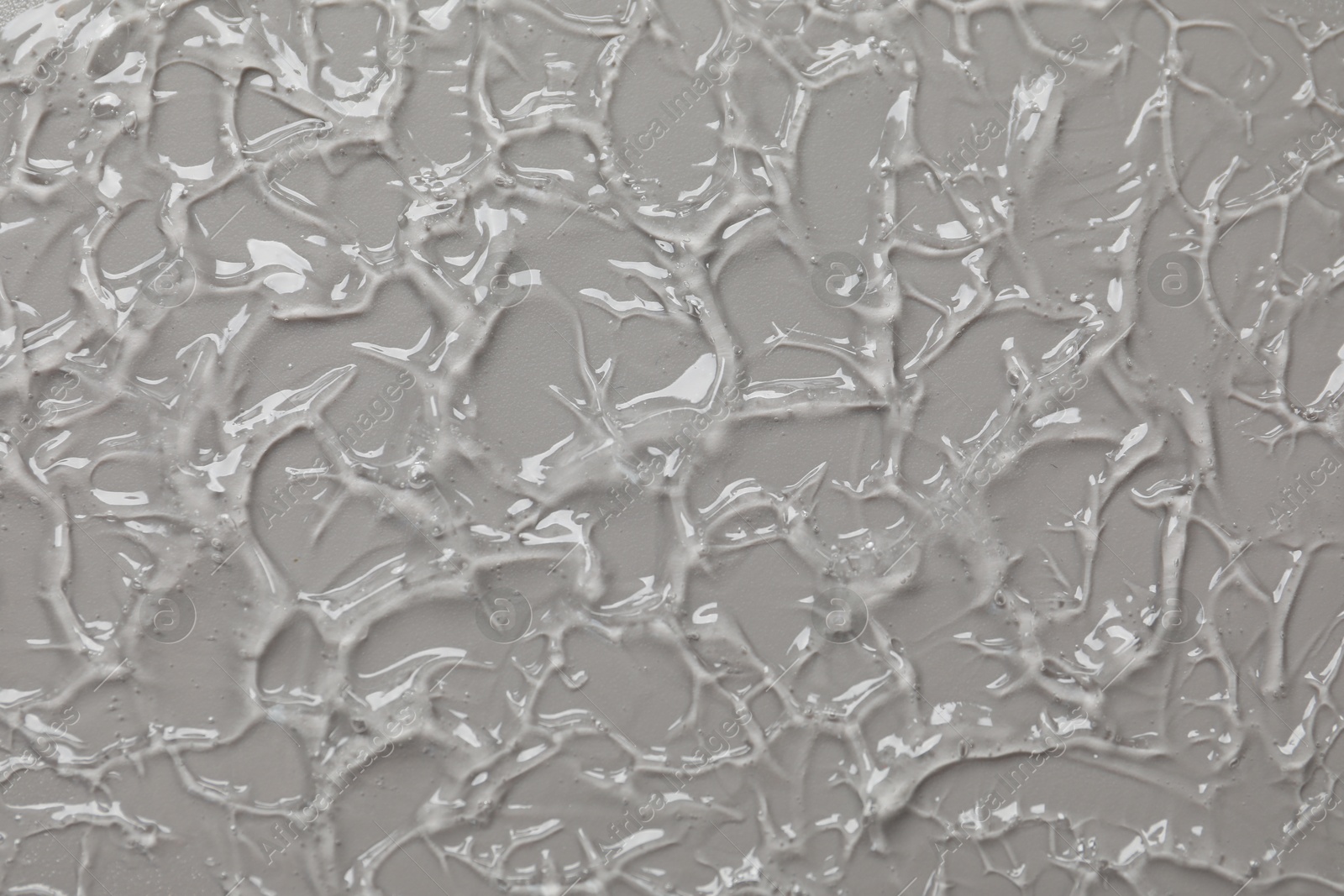 Collagen gel on grey background, top view Photo of Collagen gel on grey background, top view