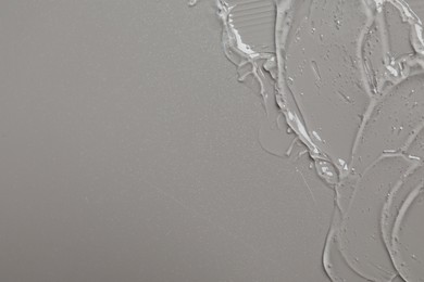 Photo of Collagen gel on grey background, top view. Space for text