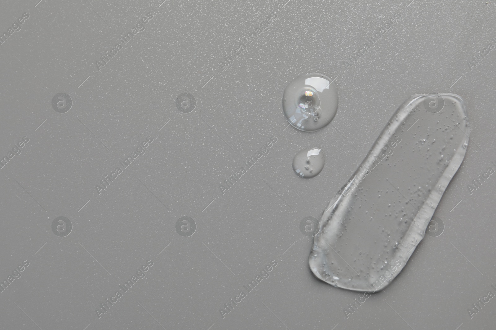 Collagen gel on grey background, top view. Space for text Photo of Collagen gel on grey background, top view. Space for text