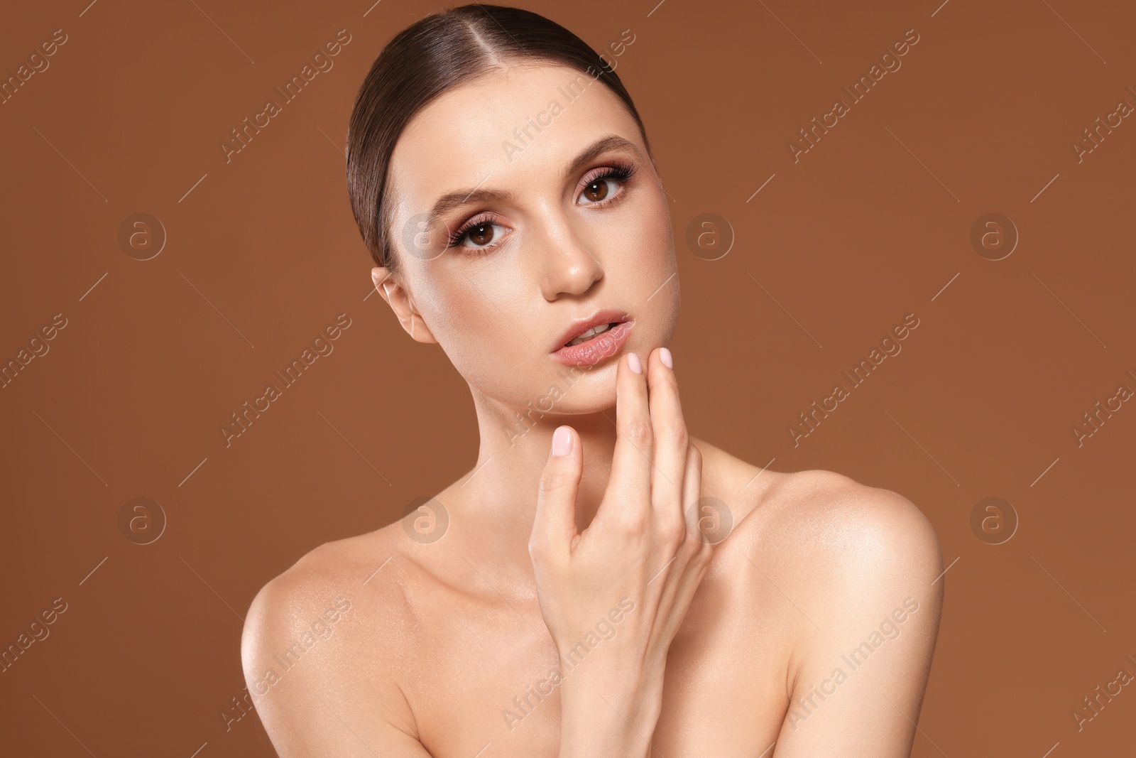 Portrait of beautiful young woman on beige background Photo of Portrait of beautiful young woman on beige background
