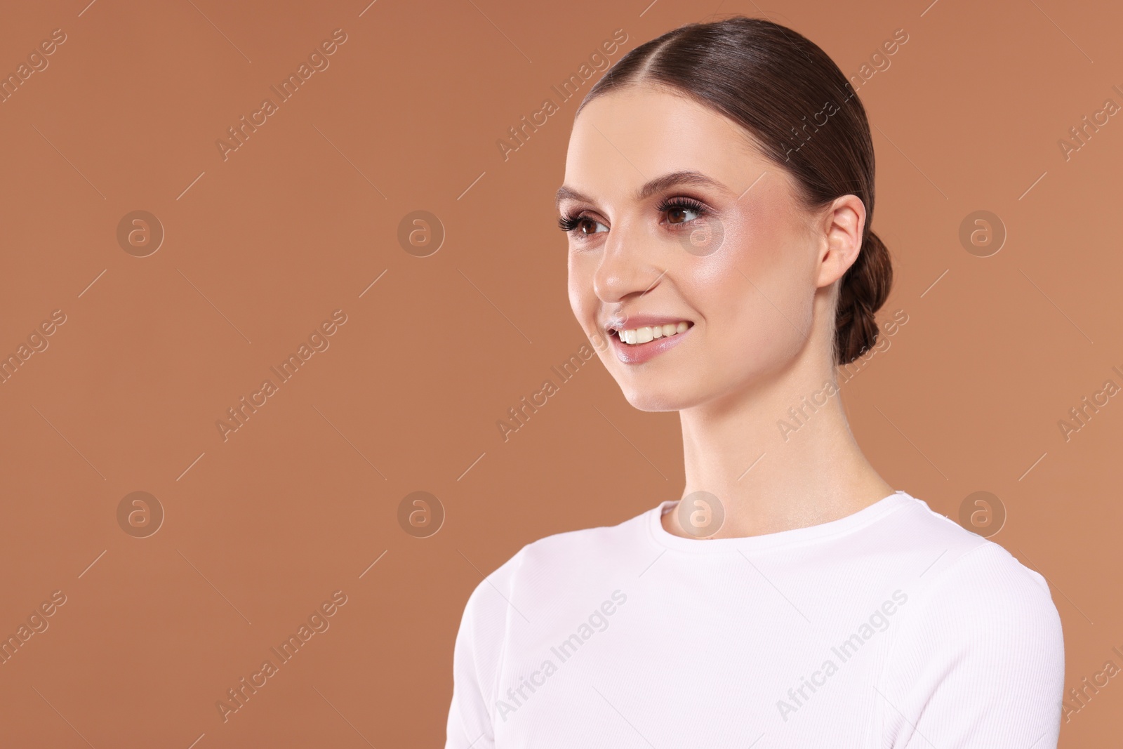 Portrait of beautiful young woman on beige background, space for text Photo of Portrait of beautiful young woman on beige background, space for text