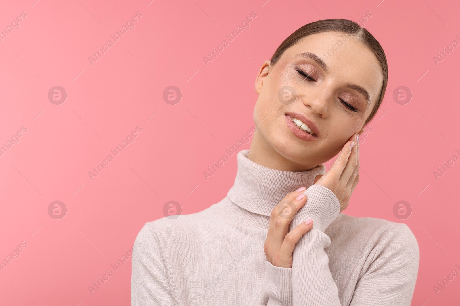 Portrait of beautiful young woman on pink background, space for text Photo of Portrait of beautiful young woman on pink background, space for text
