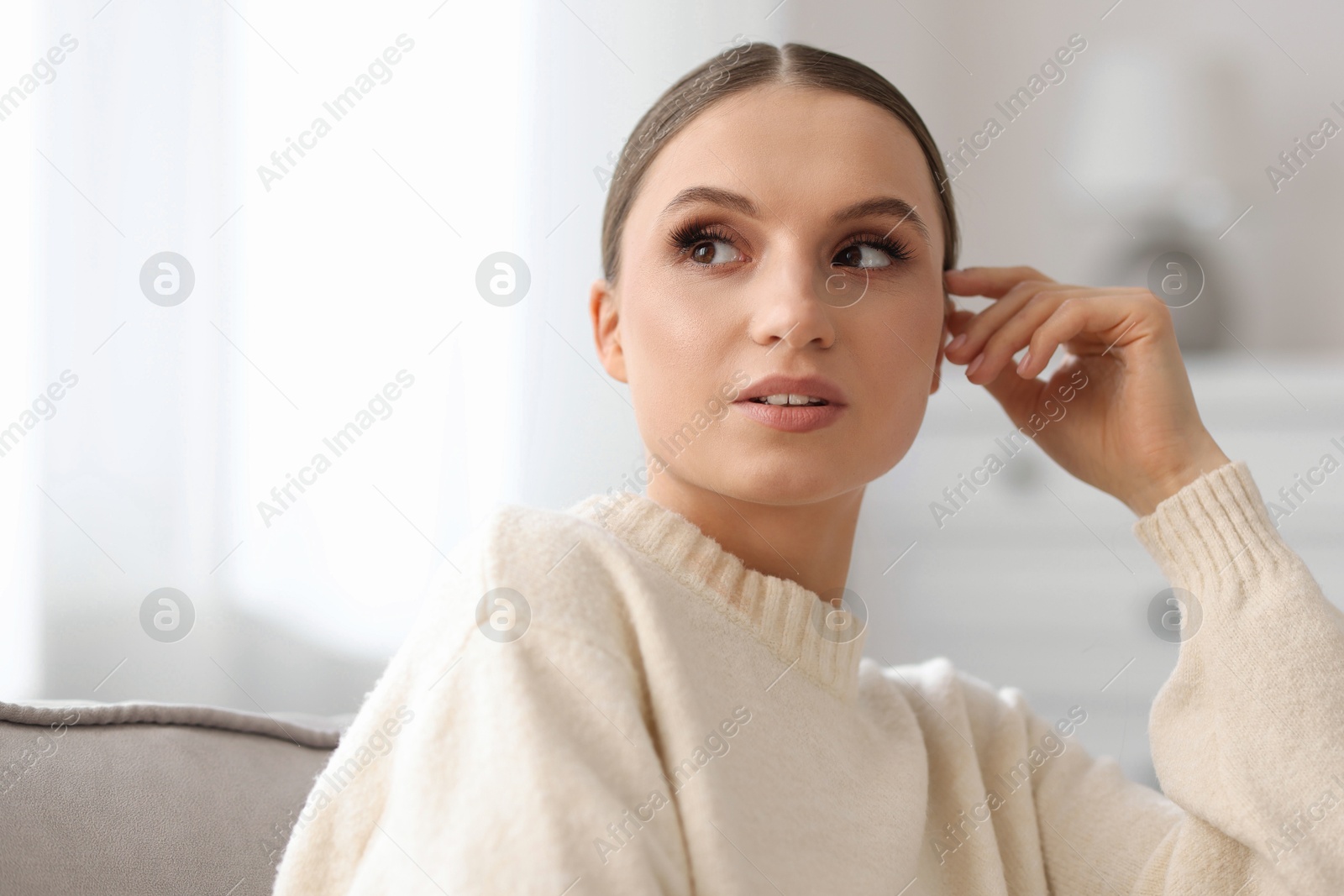 Portrait of beautiful young woman at home Photo of Portrait of beautiful young woman at home