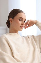 Photo of Portrait of beautiful young woman at home
