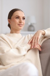 Photo of Portrait of beautiful young woman at home