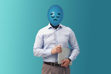 Image of Balloon with sad face instead of man's head on light blue background
