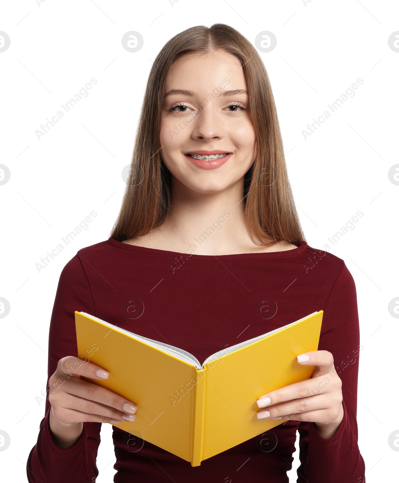 Teenage girl with book on white background Photo of Teenage girl with book on white background
