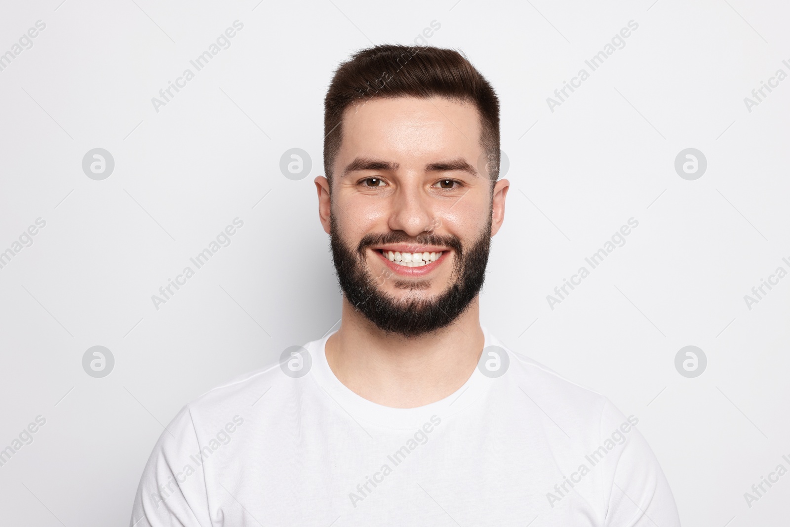 Portrait of handsome man on light background Photo of Portrait of handsome man on light background