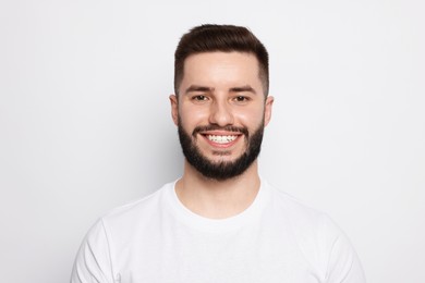 Photo of Portrait of handsome man on light background