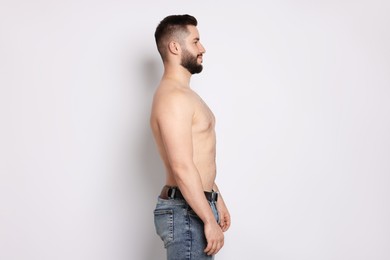 Photo of Man after weight loss on light background