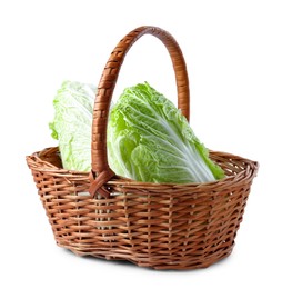 Photo of Fresh Chinese cabbages in wicker basket isolated on white