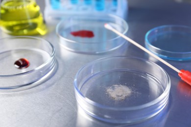 Photo of Petri dishes with samples on table, closeup