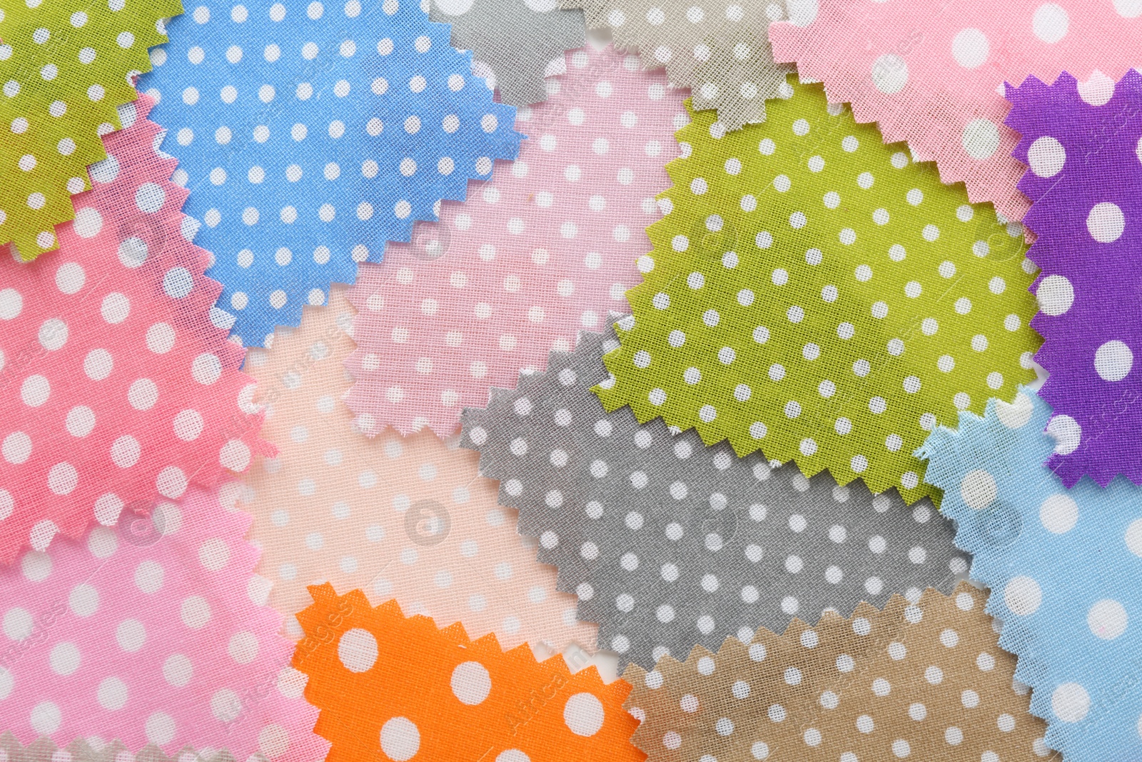 Samples of different fabrics as background, top view Photo of Samples of different fabrics as background, top view