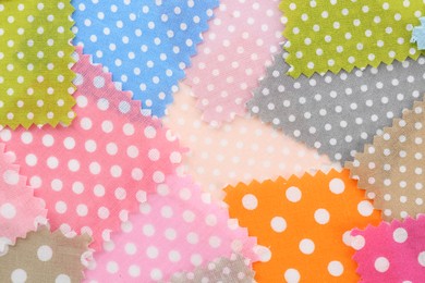 Photo of Samples of different fabrics as background, top view