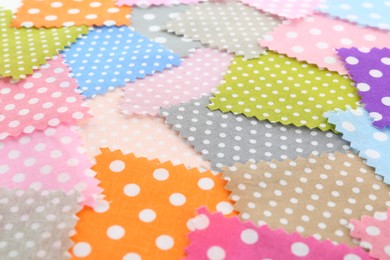 Photo of Samples of different fabrics as background, closeup