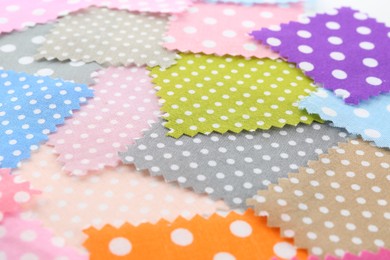 Photo of Samples of different fabrics as background, closeup