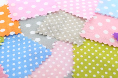 Photo of Samples of different fabrics as background, closeup