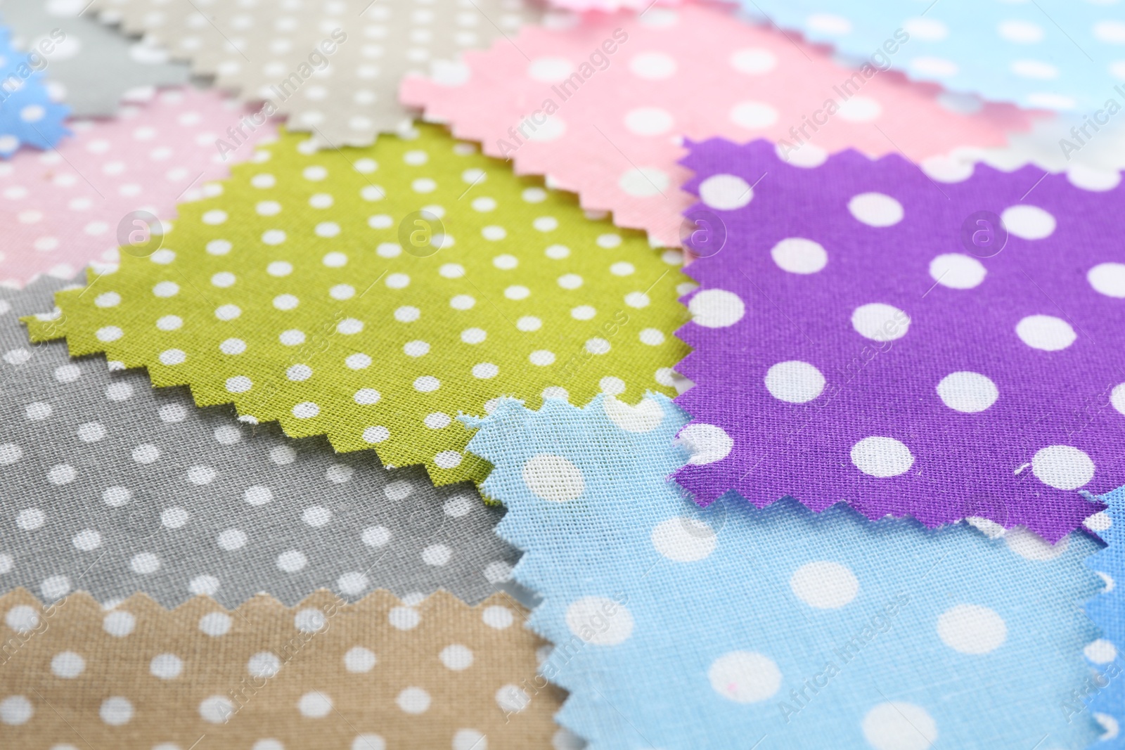 Samples of different fabrics as background, closeup Photo of Samples of different fabrics as background, closeup