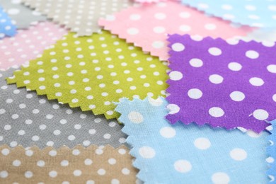 Photo of Samples of different fabrics as background, closeup