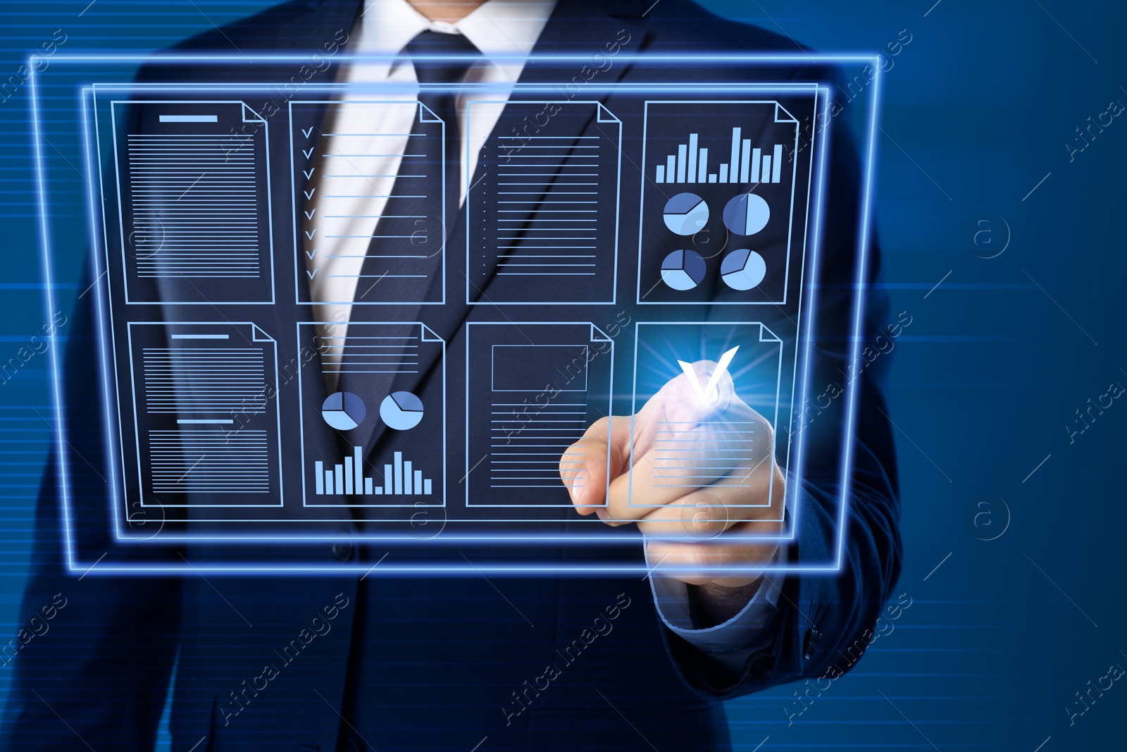 Businessman approving documents on virtual screen against blue background, closeup Image of Businessman approving documents on virtual screen against blue background, closeup