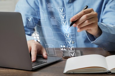 Image of Man approving documents on virtual screen above laptop at table, closeup