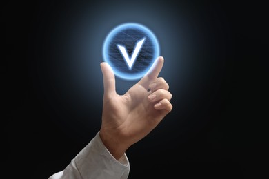 Image of Approved. Woman holding virtual check mark against black background, closeup