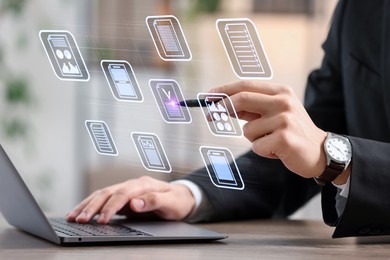 Image of Man approving documents on virtual screen above laptop at table, closeup