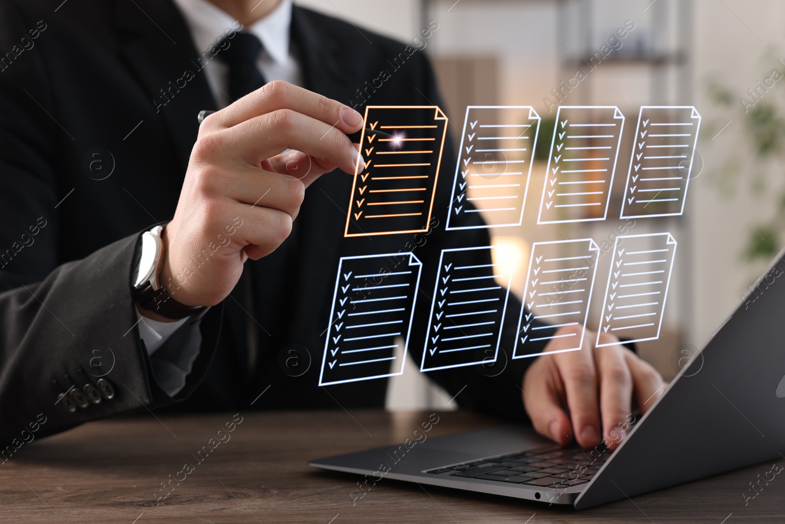 Man approving documents on virtual screen above laptop at table, closeup Image of Man approving documents on virtual screen above laptop at table, closeup