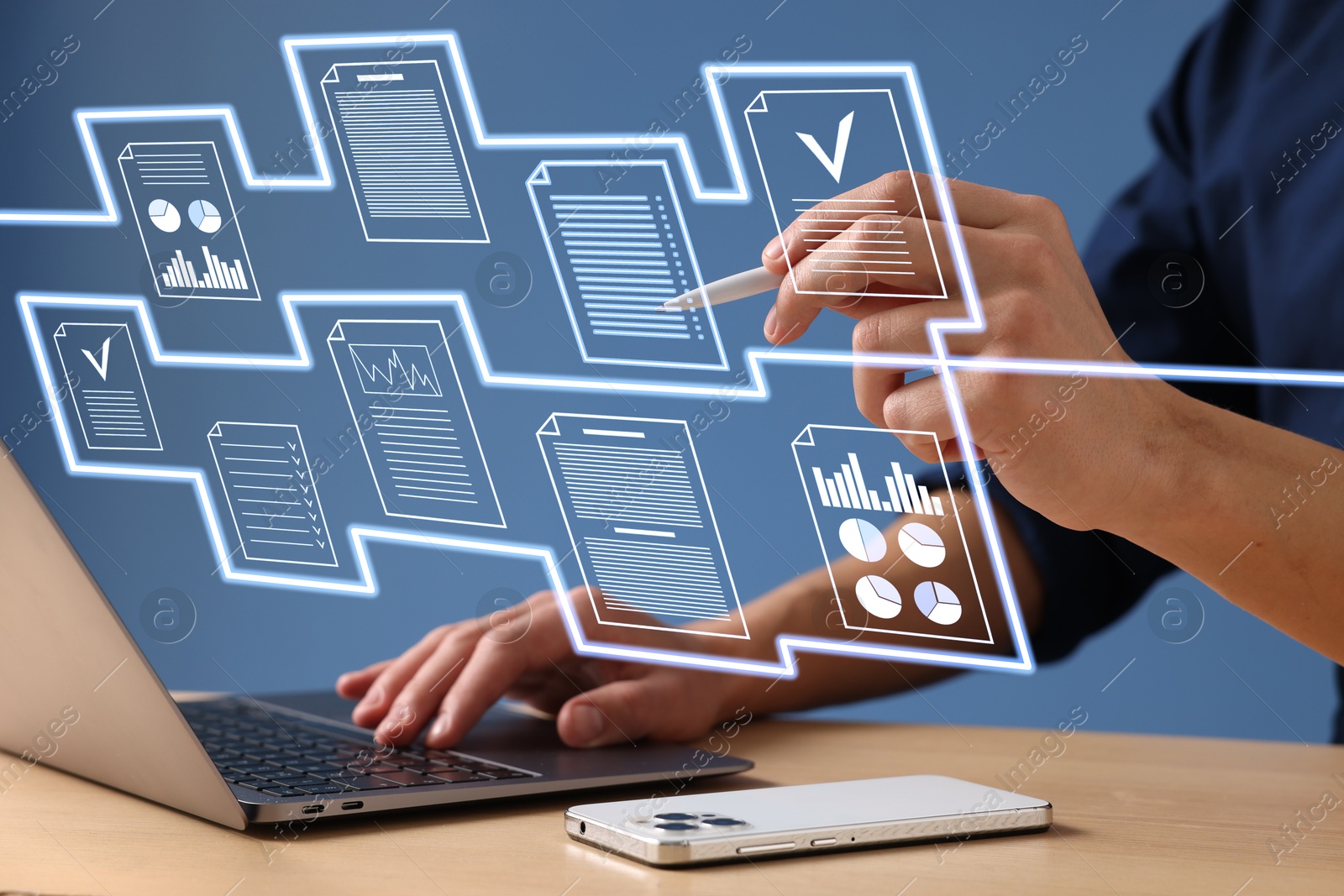 Man approving documents on virtual screen above laptop at table, closeup Image of Man approving documents on virtual screen above laptop at table, closeup