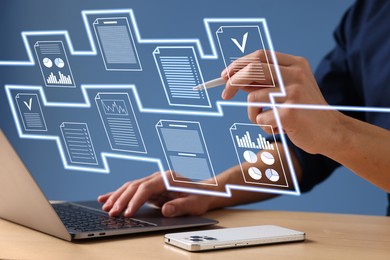 Image of Man approving documents on virtual screen above laptop at table, closeup