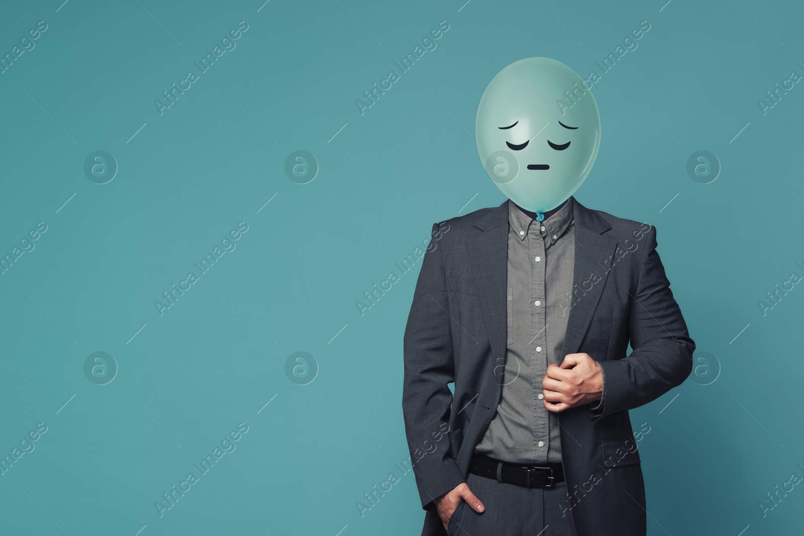 Balloon with sad face instead of man's head on blue background. Space for text Image of Balloon with sad face instead of man's head on blue background. Space for text