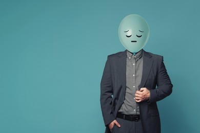 Image of Balloon with sad face instead of man's head on blue background. Space for text