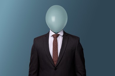 Image of Businessman with balloon instead of his head on blue grey background