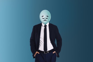 Image of Balloon with sad face instead of man's head on blue background