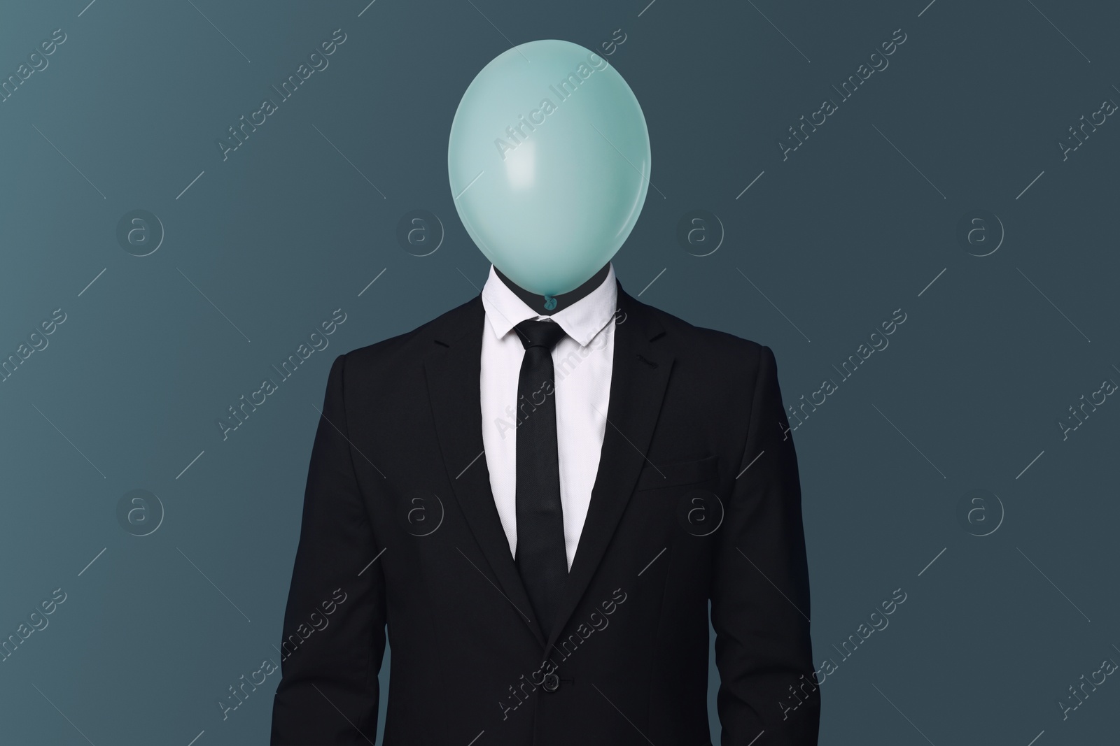Businessman with balloon instead of his head on blue grey background Image of Businessman with balloon instead of his head on blue grey background
