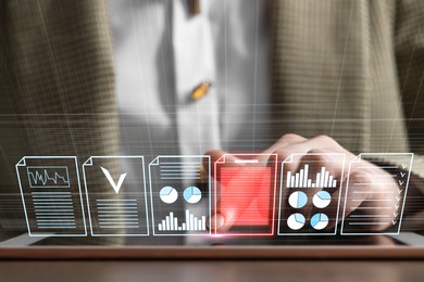 Image of Woman working with documents on virtual screen above tablet computer at table, closeup. Approve or reject