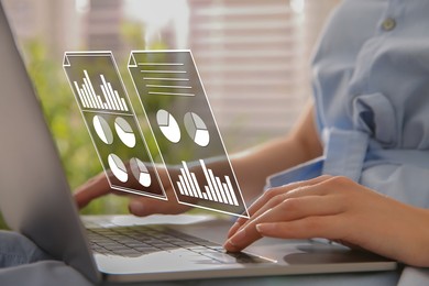 Image of Woman using laptop at table, closeup. Virtual screen with documents above computer