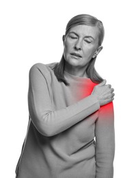 Image of Arthritis. Senior woman suffering from pain in shoulder on white background. Black and white toning with red color accent
