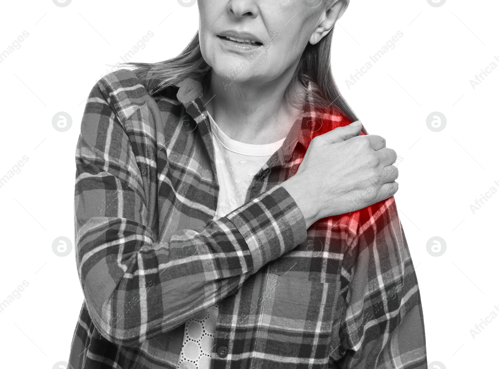 Arthritis. Woman suffering from pain in shoulder on white background, closeup. Black and white toning with red color accent Image of Arthritis. Woman suffering from pain in shoulder on white background, closeup. Black and white toning with red color accent